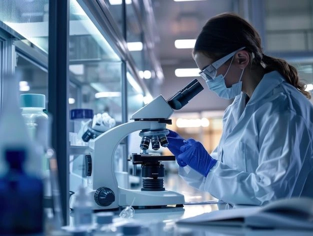 Scientist looking in microscope